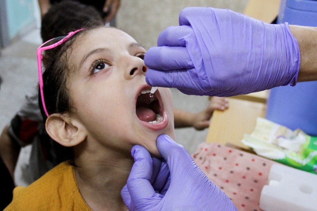 A Palestinian child is vaccinated against polio in Jabalia, in the northern Gaza Strip on September 10. Thousands of Palestinian children have missed important vaccinations because of the destruction wrought by Israel’s war against Hamas. Photo: Reuters