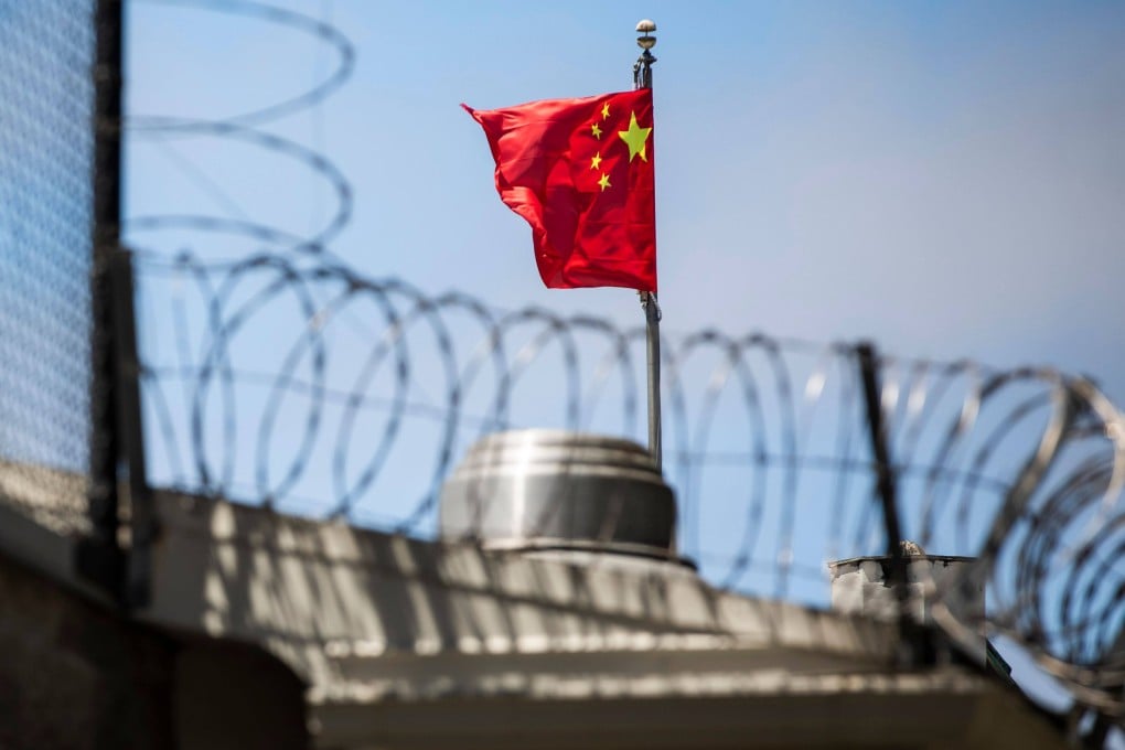 A Chinese flag flies behind barbed wire at the Chinese Consulate General in San Francisco in July 2020. Photo: AFP