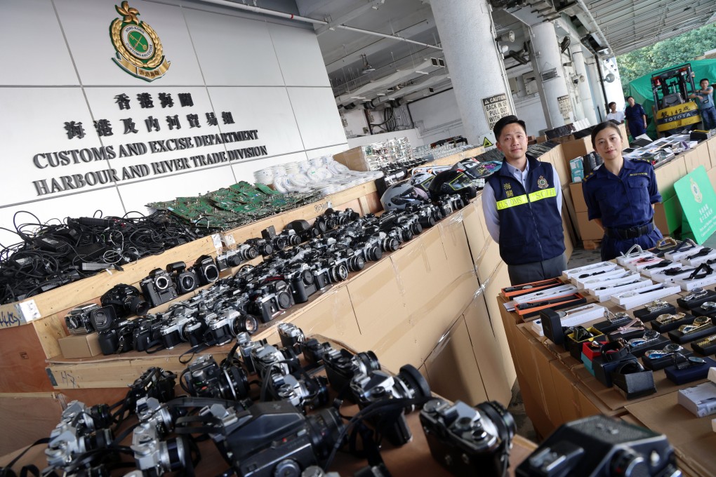 Customs officers showcase smuggled goods seized by the department earlier this month. Photo: Jelly Tse
