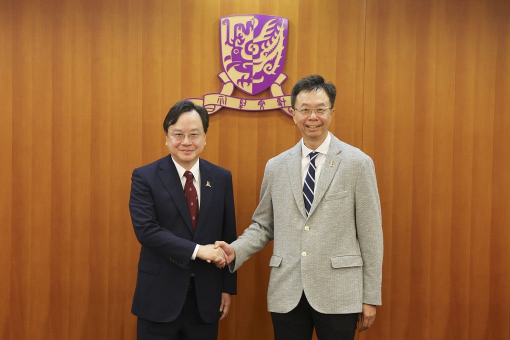 Professor Dennis Lo (left) with council chairman John Chai. Photo: Jelly Tse