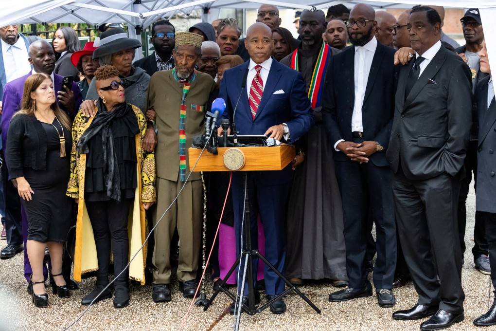 New York City Mayor Eric Adams (centre) speaks to the press outside his official residence Gracie Mansion on Thursday. Photo: Reuters
