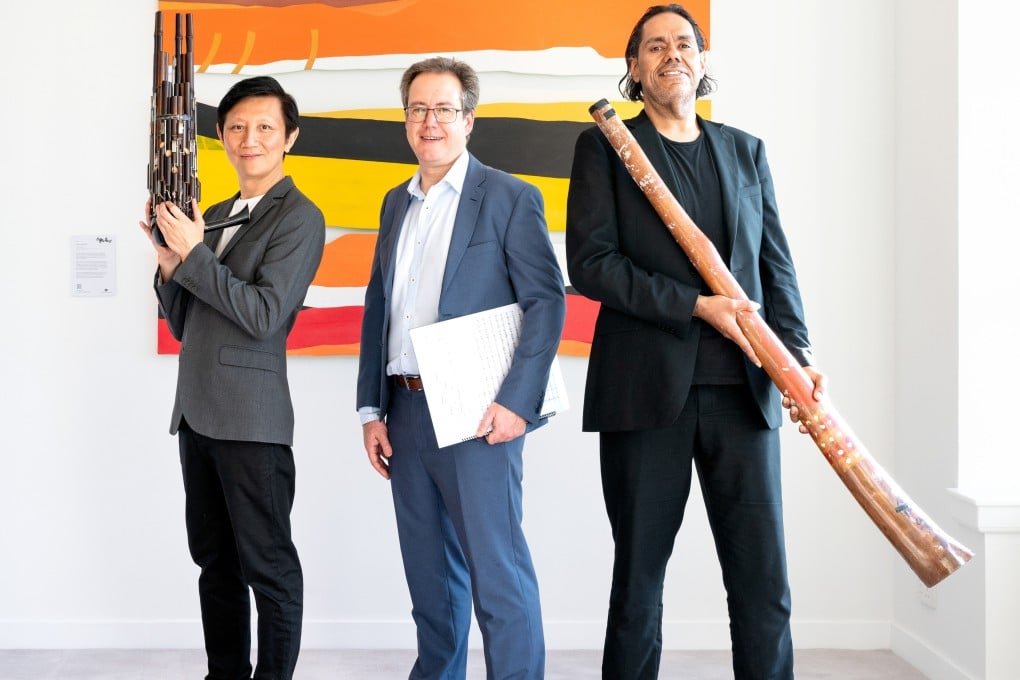 Sheng player Loo Sze-wang, conductor Luke Dollman and didgeridoo player William Barton, at the Australian Residence, Hong Kong, ahead of a performance of Dylan Crismani’s concerto for Sheng and Didgeridoo, Coming Together. Photo: Eugene Chan