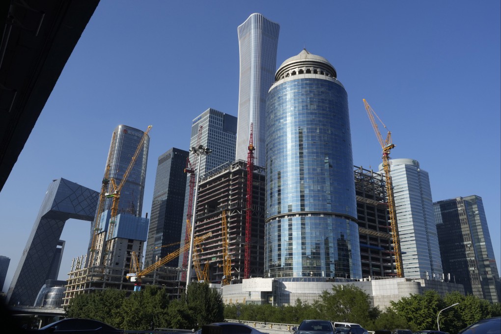 Construction cranes are seen near the central business district of Beijing on August 8, 2024. Photo: AP