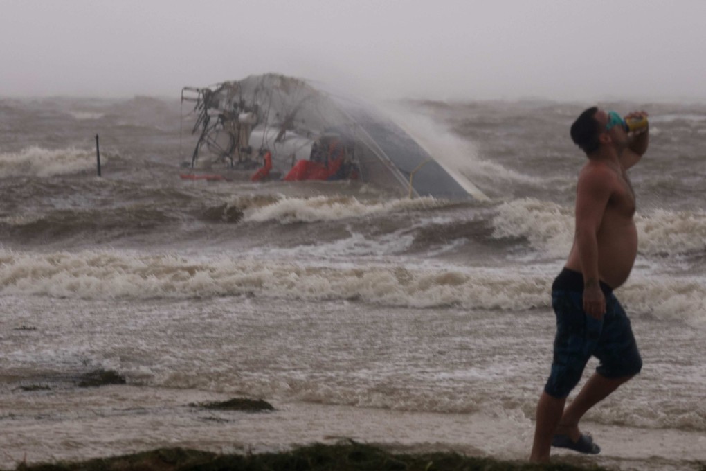 A capsized boat washes ashore as Hurricane Helene churns offshore on in St Petersburg Florida. Photo: AFP