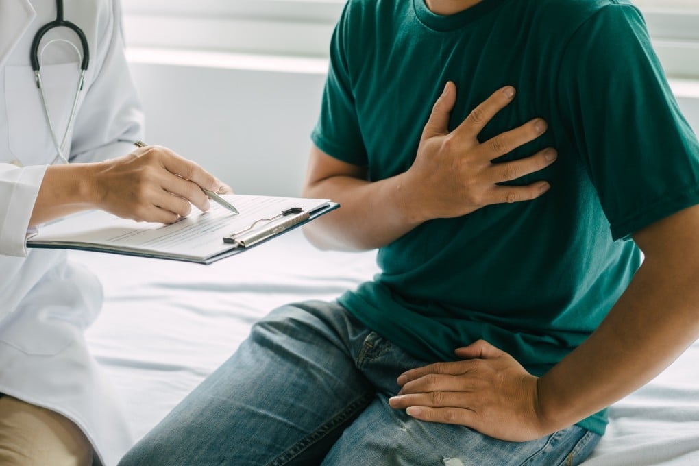 A male patient with heart pain speaks to a specialist in hospital. Malaysia’s proposal to expand paid services in public hospitals has sparked fears of a two-tier system. Photo: Shutterstock