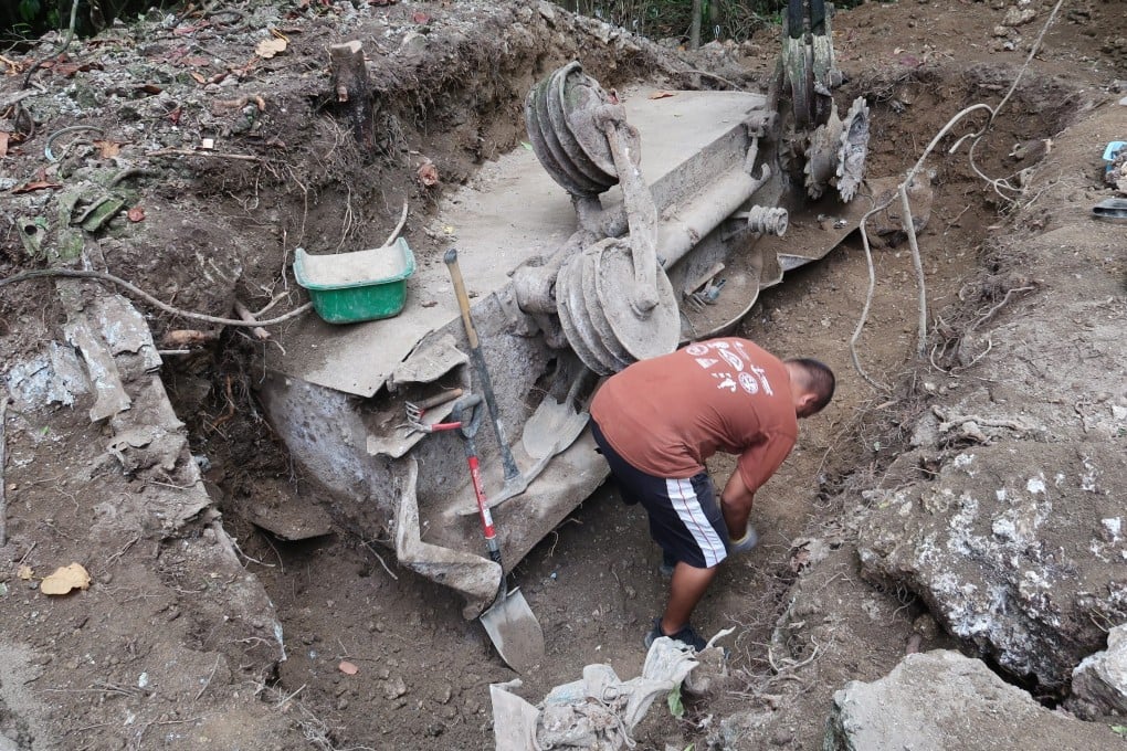 Excavation progresses on a Japanese Type 95 light tank that was knocked out by US Marines in 1944. Photo: Julian Ryall