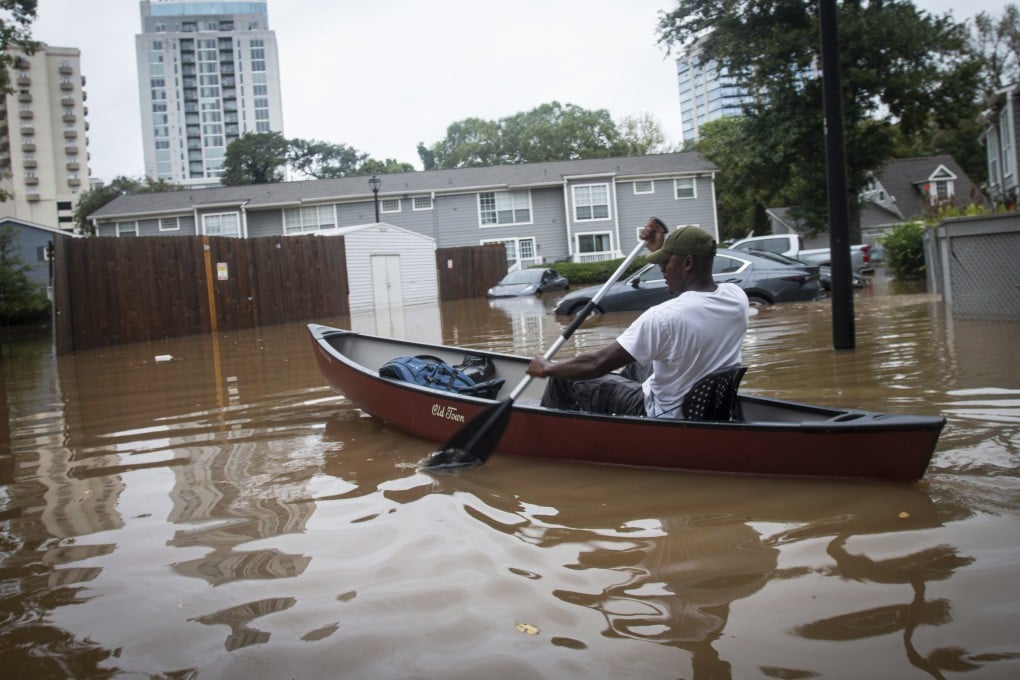 A man paddles a canoe in flooded Atlanta streets to rescue residents and their belongings at a flooded apartment complex, after Hurricane Helene passed the area, on Friday. Photo: AP