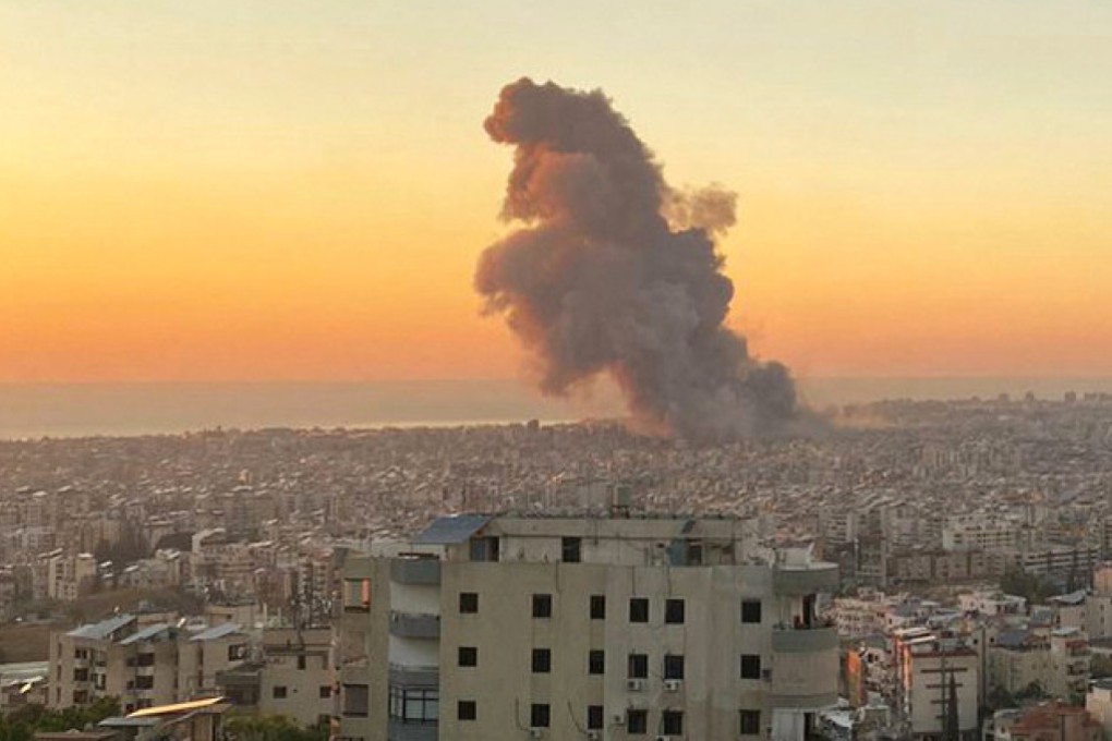 Smoke rises above Beirut’s southern suburbs during an Israeli air strike on Friday. Photo: AFP