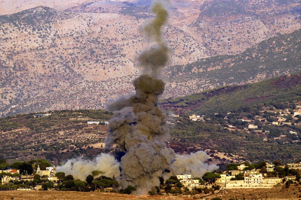 A smoke plume erupts after an Israeli airstrike targets the outskirts of a village in southern Lebanon on Monday. Photo: AFP