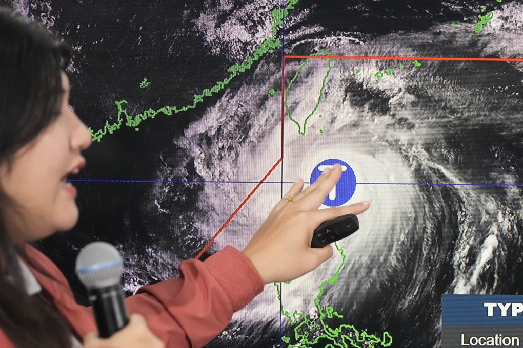 A Filipino forecaster points at an electronic board showing the strength of Typhoon Krathon on Monday. Photo: AP