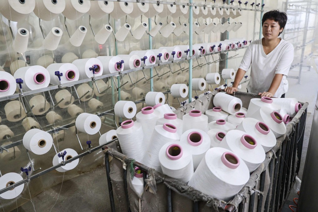 An employee works at a textile factory in Binzhou, in eastern China’s Shandong province. Photo: AFP