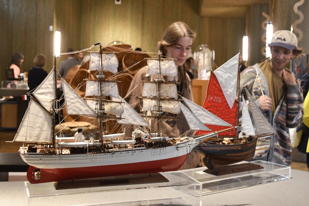 Visitors attend an exhibition of model ships made by Le Village at the Homo Faber 2024 show in Venice, Italy, on September 13, 2024. The Madagascan company makes exact replicas of some of history’s most famous ships, such as the Titanic and HMS Bounty. Photo: AP