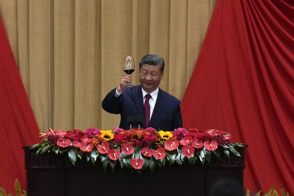 President Xi Jinping makes a toast on stage after delivering his speech at a dinner marking the 75th anniversary of the founding of the People’s Republic of China, at the Great Hall of the People in Beijing on Monday. Photo: AP