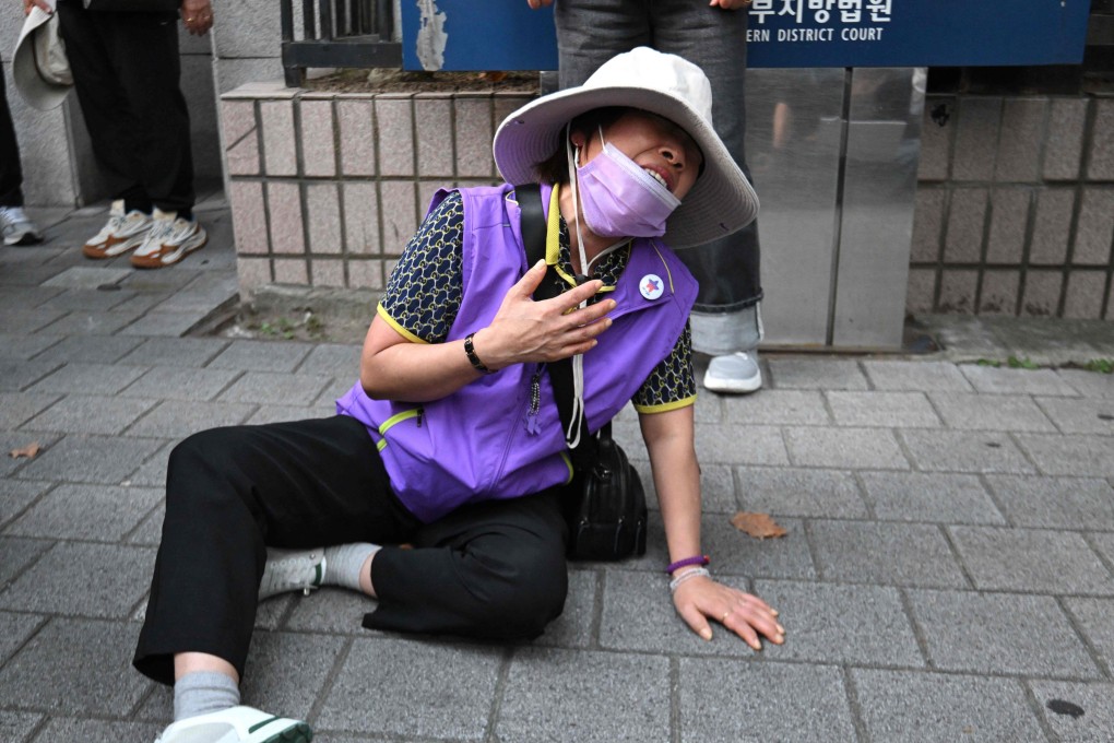 A family member of one of the Halloween crush victims cries in anguish at the Seoul Western District Court. Photo: AFP