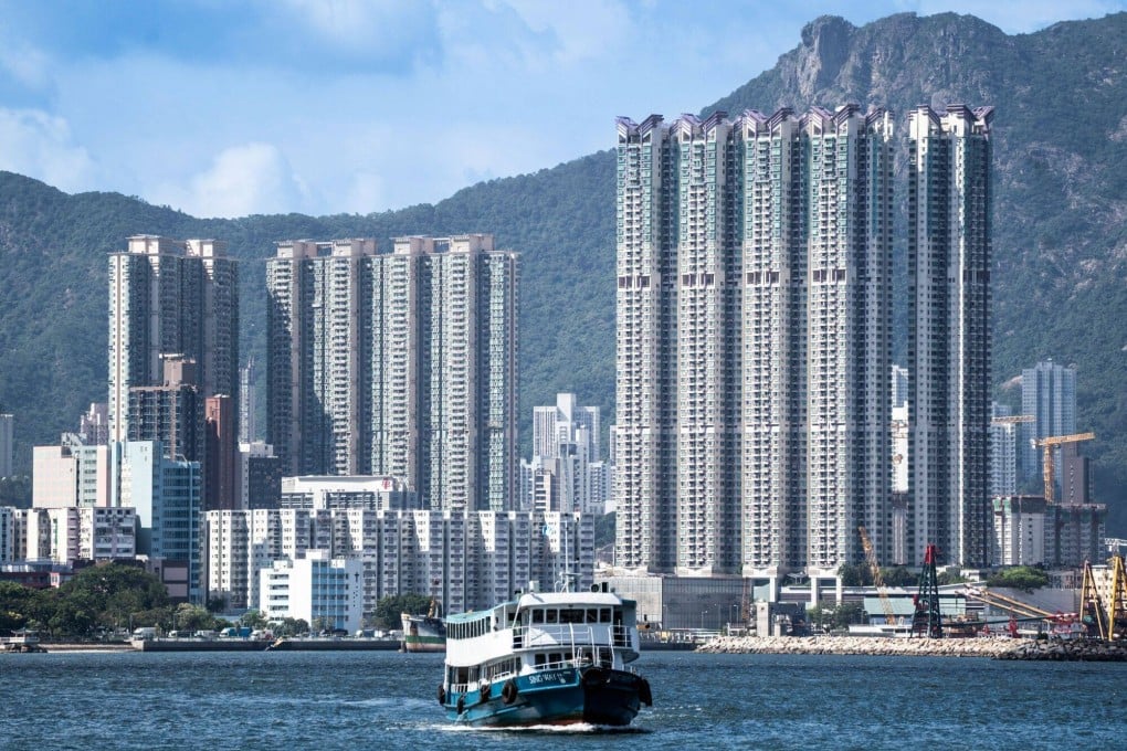 A ferry sails in front of residential buildings in Hong Kong on September 24. Photo: Bloomberg
