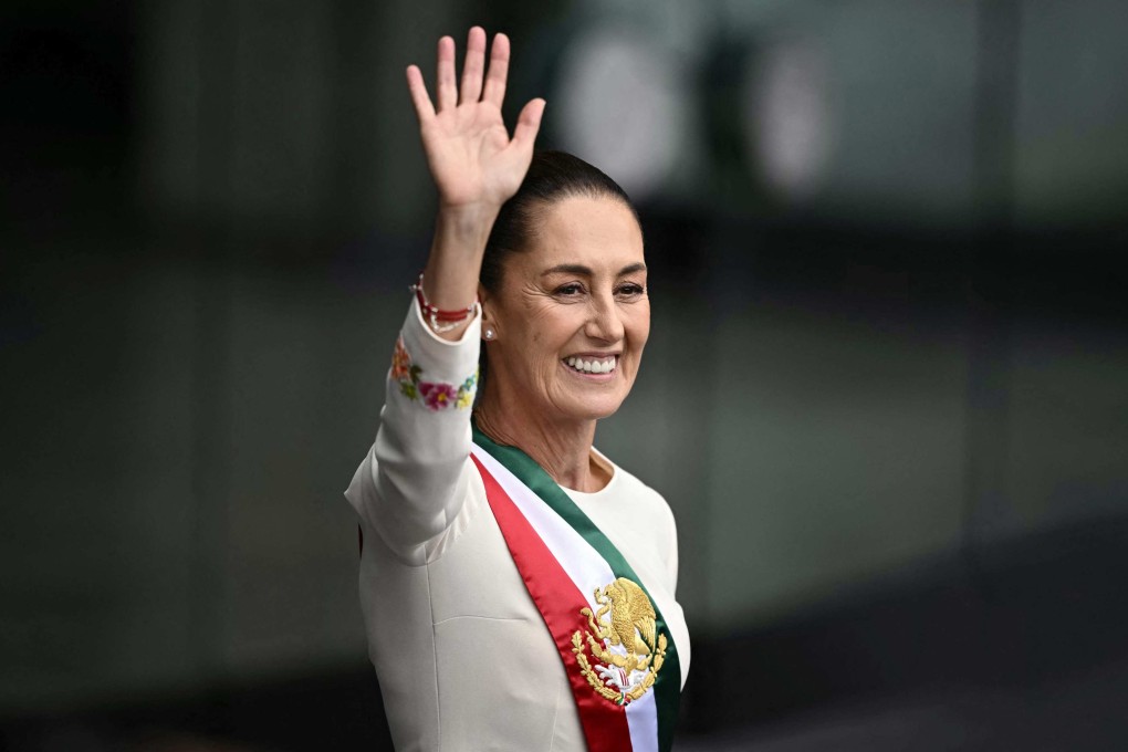Mexico’s President Claudia Sheinbaum waves at the crowd as she leaves the Congress of the Union after her inauguration ceremony in Mexico City on Tuesday. Photo: AFP