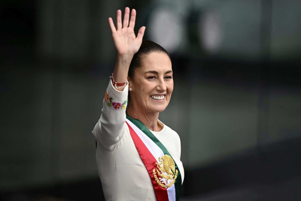 Mexico’s President Claudia Sheinbaum waves at the crowd as she leaves the Congress of the Union after her inauguration ceremony in Mexico City on Tuesday. Photo: AFP
