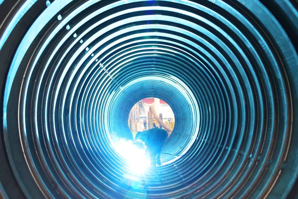 A welder works on an LNG tank container at a company producing shipping equipment in Lianyungang, in Jiangsu province, on March 15, 2023. Photo: Xinhua