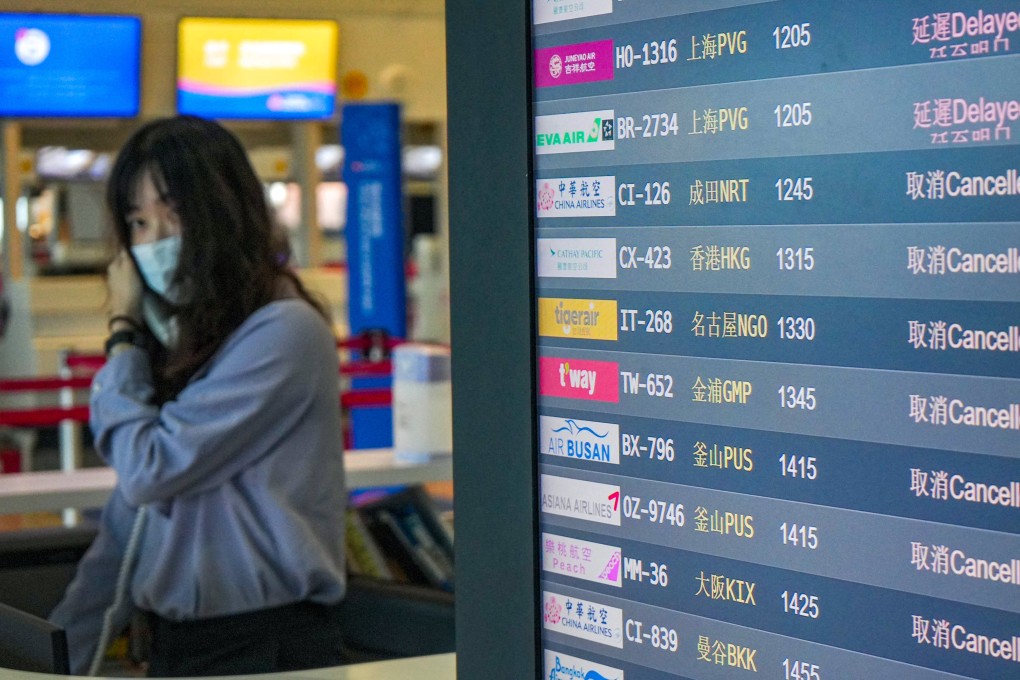 A screen showing flight status at Kaohsiung International Airport. Photo: AFP