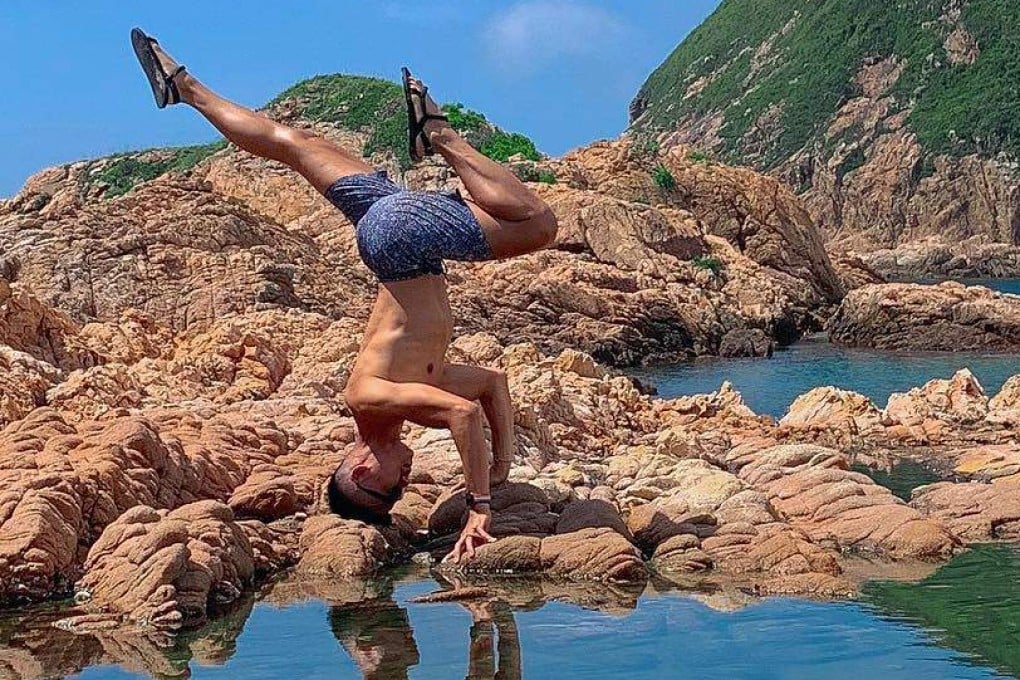 Yoga instructor Victor Chau performs a handstand in Clear Water Bay, Hong Kong. His handstand workshop in Sheung Wan is just one of the wellness events you can attend this weekend in the city. Photo: www.instagram.com/victorchauyoga