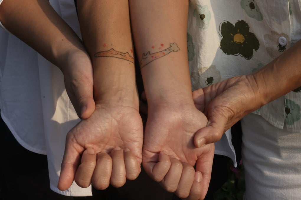 Victoria Chan Wing and her mother, Angela Lee, show their mother-daughter tattoos. Attitudes towards women getting tattoos are changing in Hong Kong. Photo: Jonathan Wong