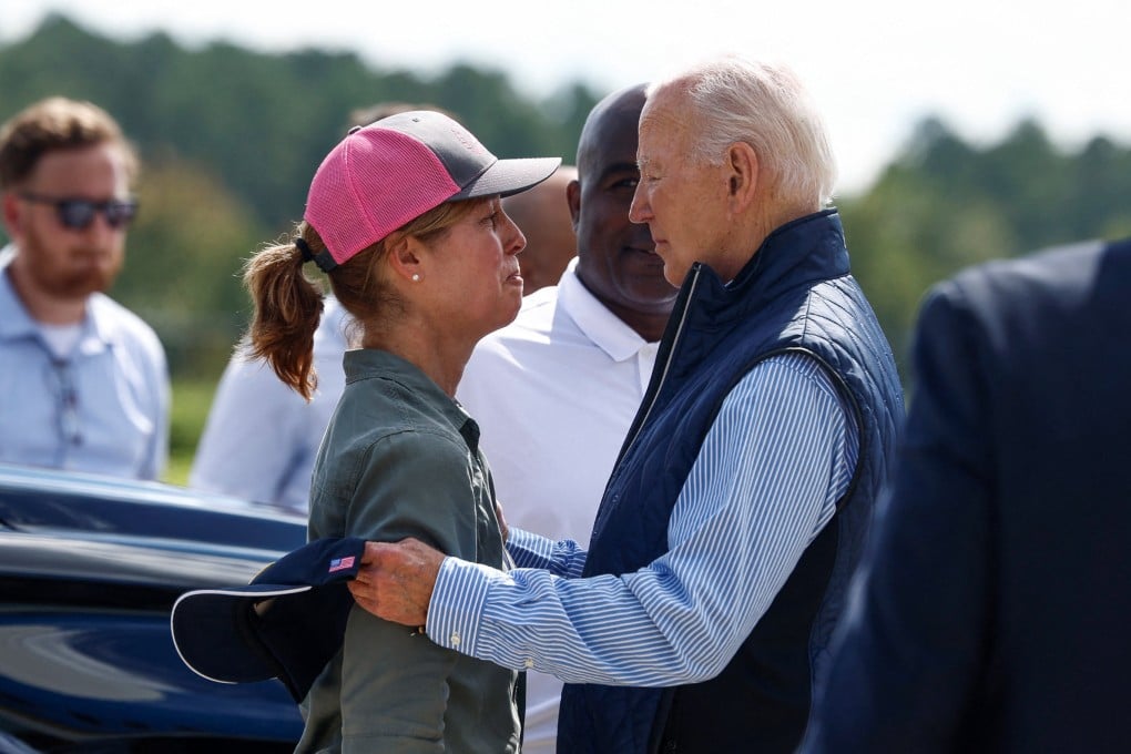 US President Joe Biden embraces Esther Manheimer, mayor of Asheville, North Carolina, at Greenville-Spartanburg International Airport in Greer, South Carolina, on Wednesday. Photo: Reuters