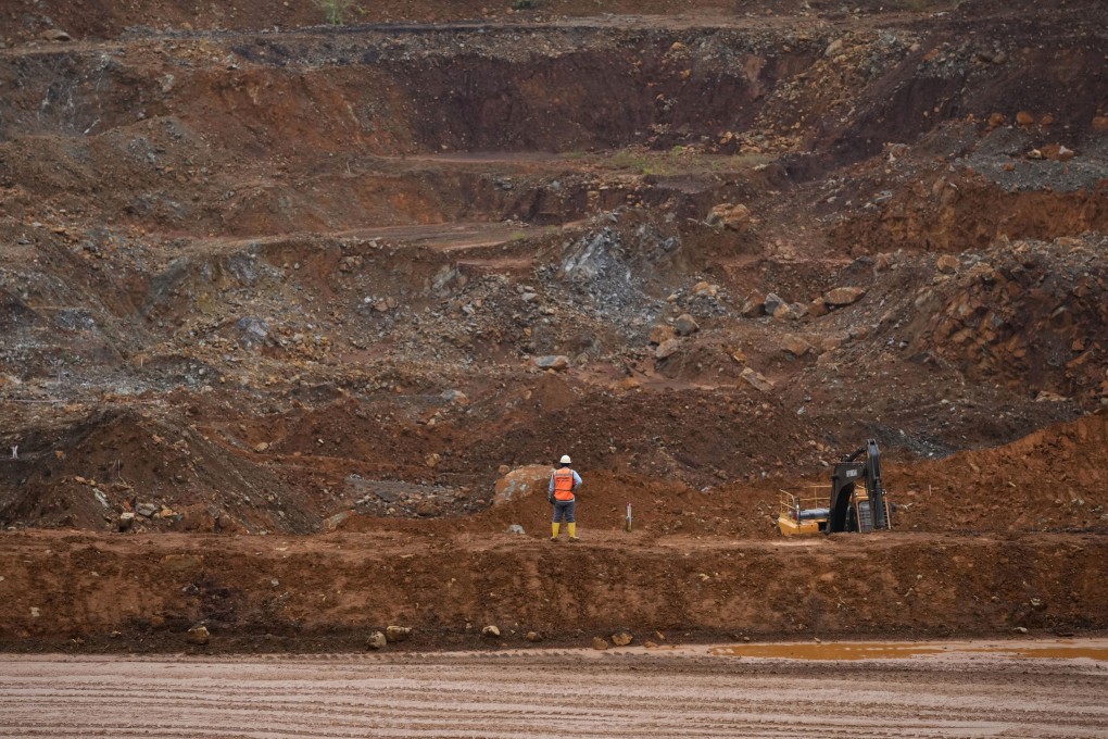 A worker stands near a mining pit in South Sulawesi, Indonesia. Photo: AP