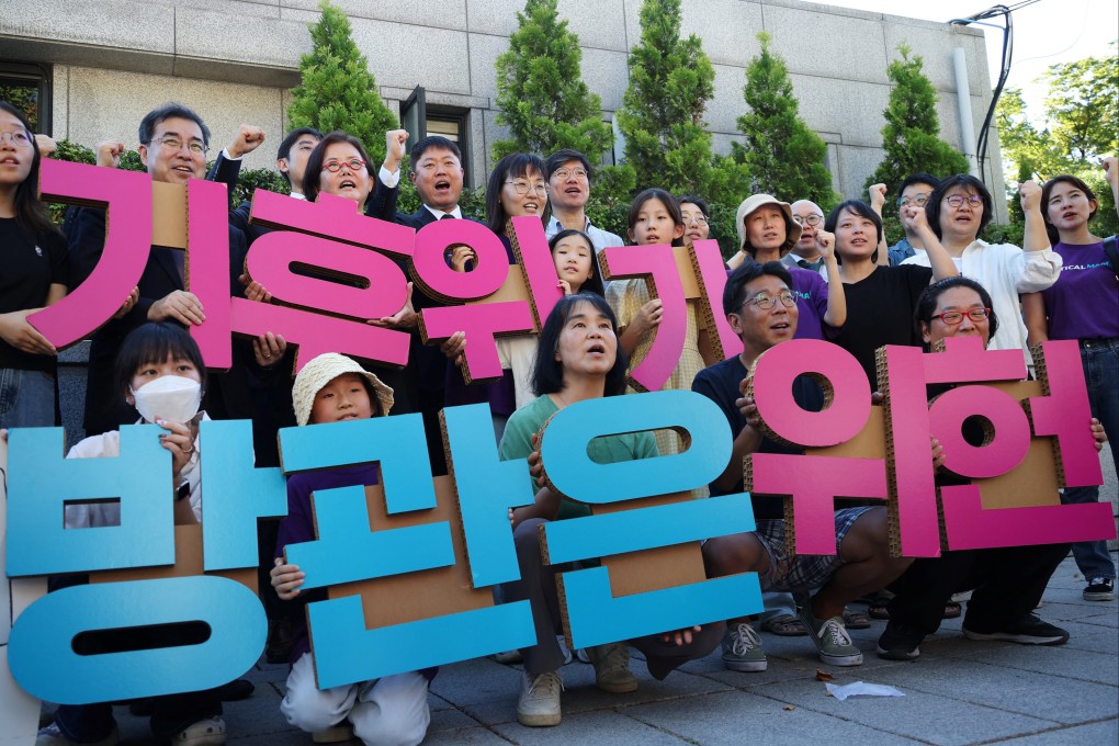 Climate activists in South Korea celebrate the constitutional court ruling that the country’s climate change law was conditionally unconstitutional, in Seoul on August 29. Their message? “Doing nothing for climate change is unconstitutional.” Photo: Reuters