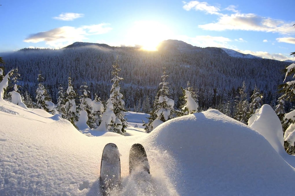 A sunny and snowy mountain scene in the distance. Photo: Getty Images