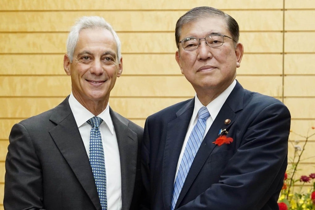 Japan’s new Prime Minister Shigeru Ishiba shakes hands with US Ambassador to Japan Rahm Emanuel (left) in Tokyo on Thursday. Photo: Kyodo