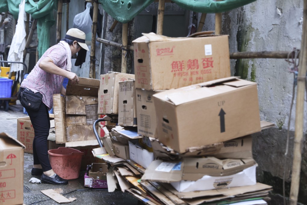 A woman collects
cardboard on the streets of Hong Kong’s Wan Chai district. Photo: Edmond So