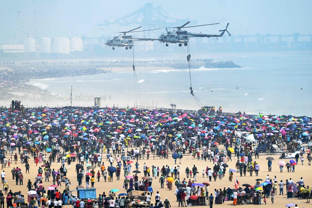 Indian Air Force helicopters perform during the air show at Marina Beach in Chennai on Sunday. Photo: AFP