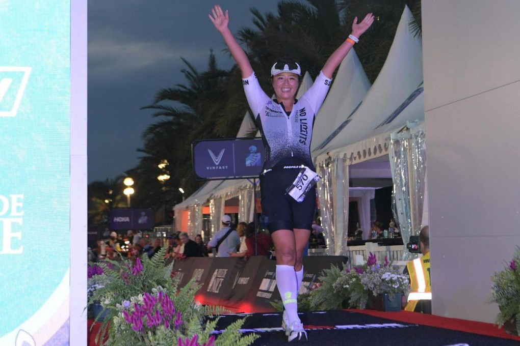 Ruby Cheng raises her arms in triumph after coming home in 12 hours, one minute and 51 seconds for 282nd place. Photo: Ruby Cheng