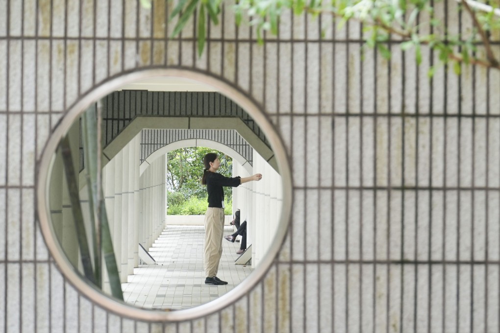 A woman exercises during lunch hour at Hong Kong Park, in Admiralty, on May 28. Poor working conditions limit time for physical activity and lead to a reliance on fast and processed food, increasing absenteeism and hurting productivity. Photo: Sam Tsang