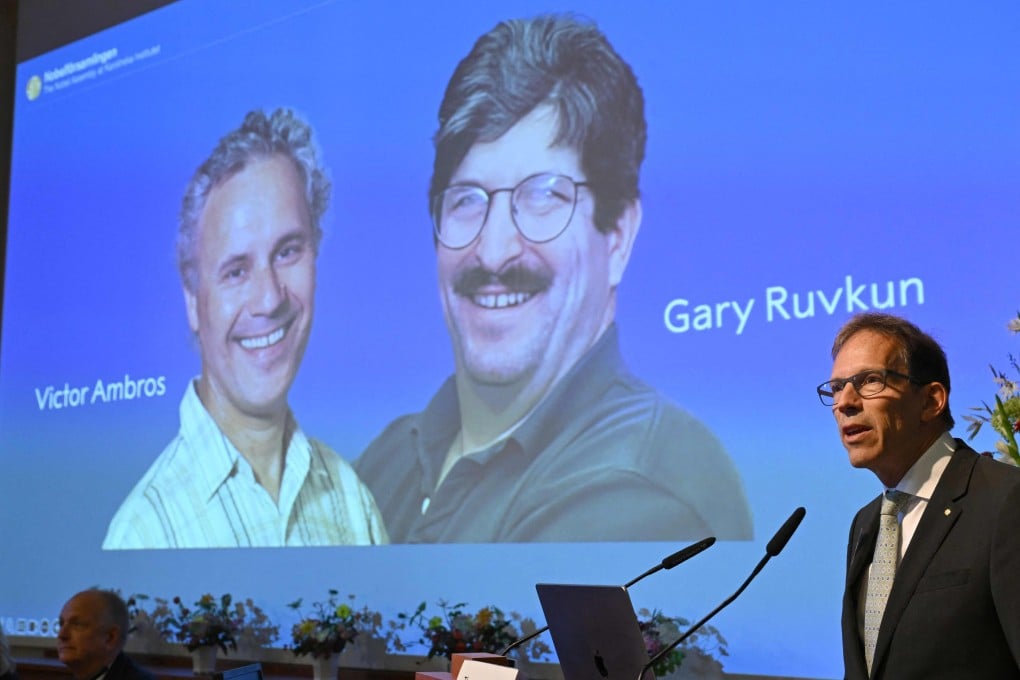 Nobel Committee Secretary General Thomas Perlmann speaks to the media in front of a picture of this year’s laureates Victor Ambros and Gary Ruvkum during the announcement of the winners of the 2024 Nobel Prize in Physiology or Medicine. Photo: AFP