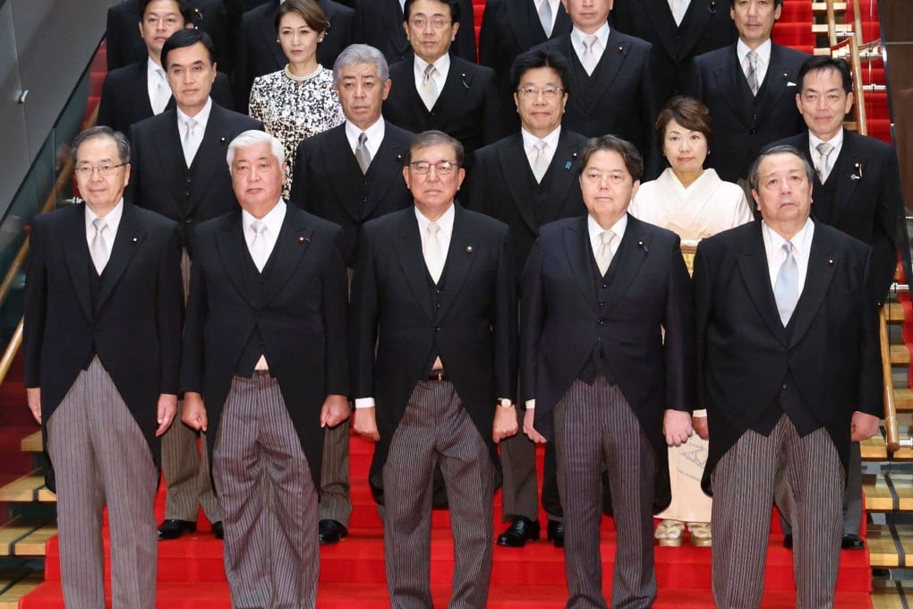 Japan’s new Prime Minister Shigeru Ishiba (front, centre) poses for a photo with the members of his cabinet on October 1. Photo: Jiji press/AFP