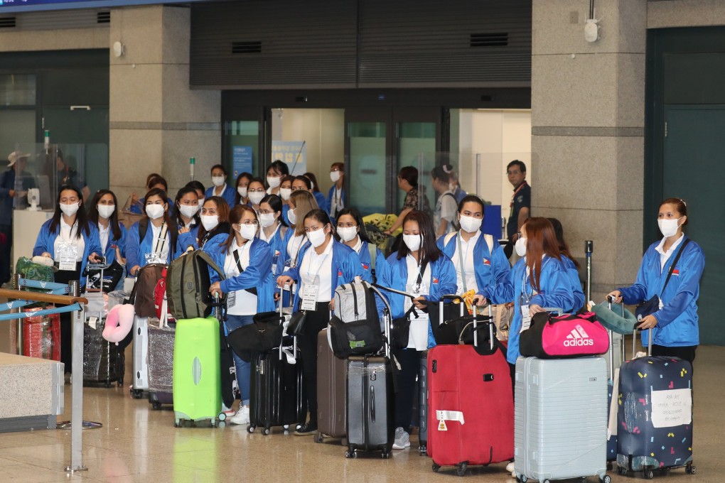 Some of the 100 Filipino women who are part of Seoul’s pilot programme for domestic workers pictured at Incheon International Airport in August. Photo: Yonhap/EPA-EFE
