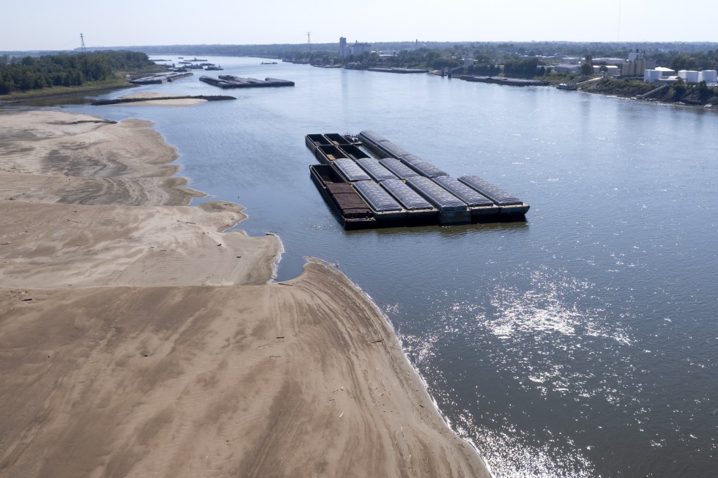 Barges float in the Mississippi River as a portion of the riverbed is exposed. Photo: AFP