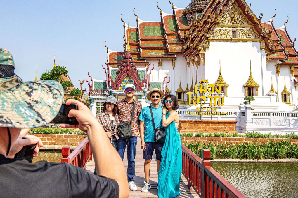 Chinese tourists pose for a group photo at Ancient Siam in Samut Prakan, Thailand. Photo: Xinhua