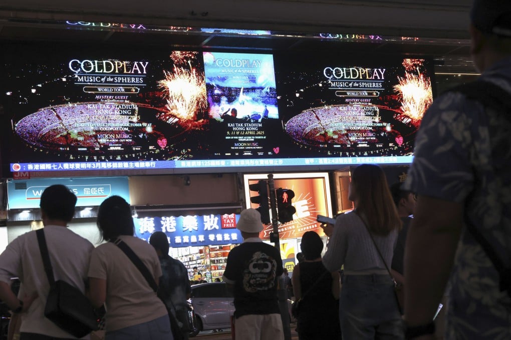 An outdoor screen in Tsim Sha Tsui displays an advert for Coldplay’s concerts in Hong Kong next year. Photo: Jelly Tse