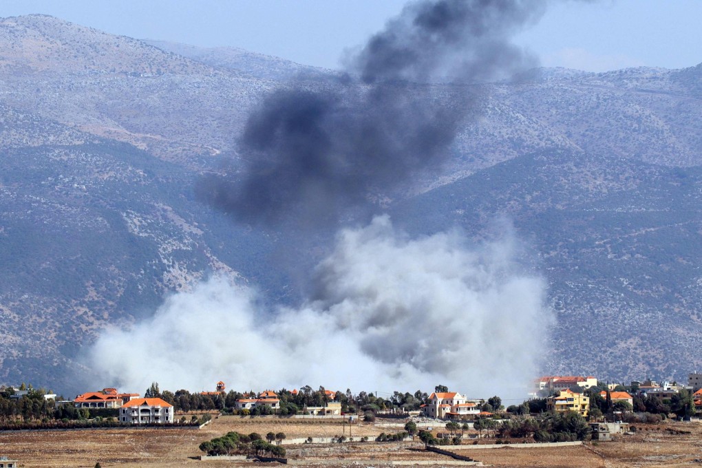 Smoke rises from the site of an Israeli air strike that targeted the southern Lebanese village of Khiam on October 8. Photo: AP