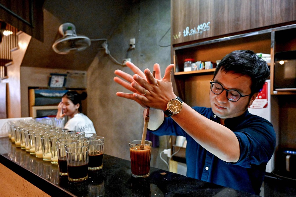 Owner Nguyen Duc Hieu making coffee at Thai Café, in Hanoi. Young entrepreneurs are changing Vietnam’s coffee culture. Photo: AFP