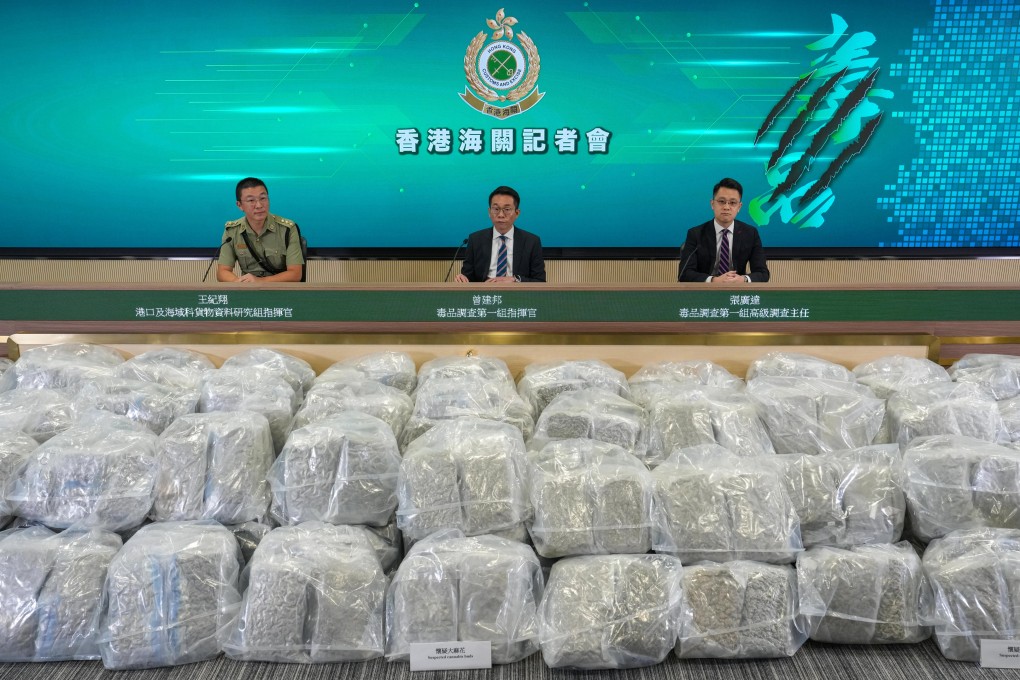 Assistant Superintendent Jacky Tsang (centre) of customs’ drugs investigation bureau, flanked by colleagues in at a press conference displaying the department’s 500kg haul of suspected cannabis buds. Photo: Elson Li