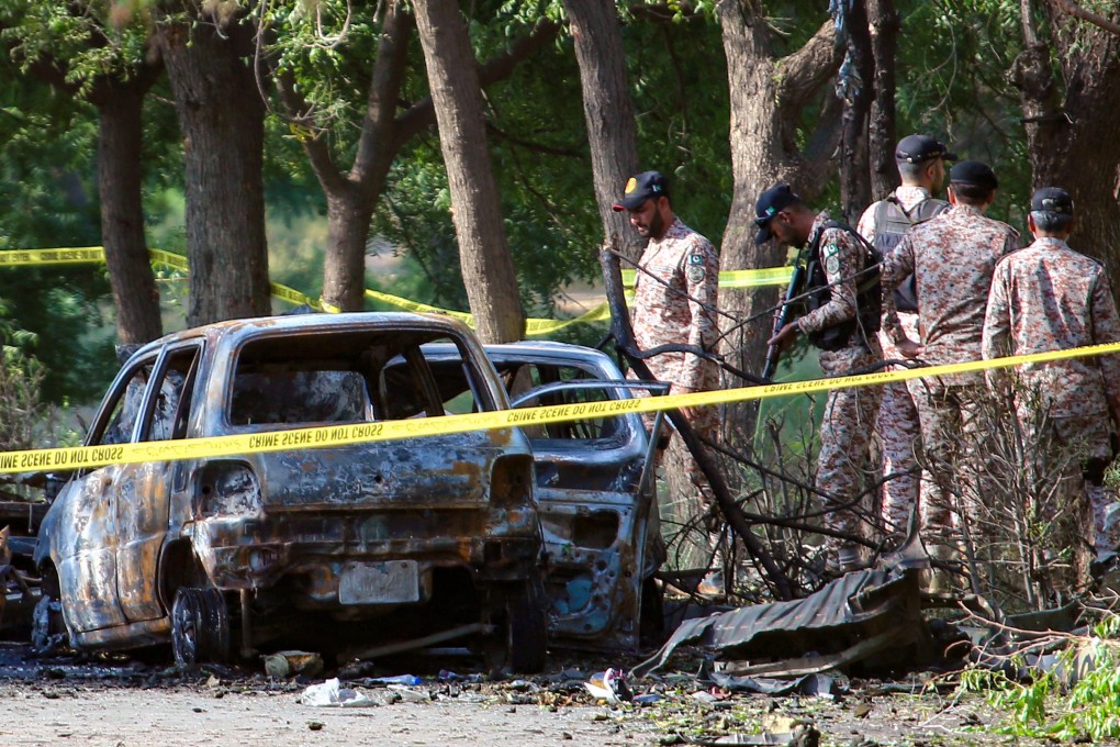 Security officials inspect the scene of a blast near Jinnah International Airport in Karachi, Pakistan. China’s
Ministry of State Security says combating terrorism is a “shared responsibility of the international community”. Photo: EPA-EFE