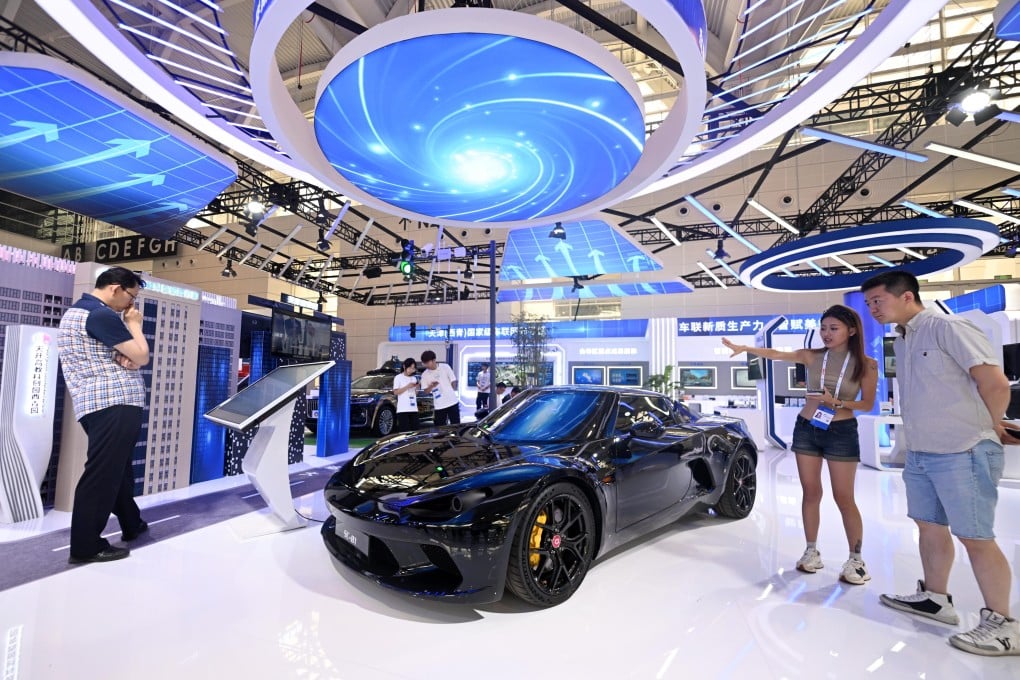 Visitors looking at a new-energy sports car at the World Intelligence Expo 2024 in Tianjin, China in June 2024. Photo: Xinhua