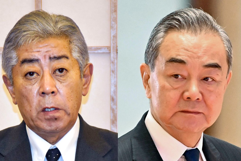 Takeshi Iwaya (left) held his first phone  call as foreign minister with Chinese counterpart Wang Yi. Photo: Kyodo, AFP