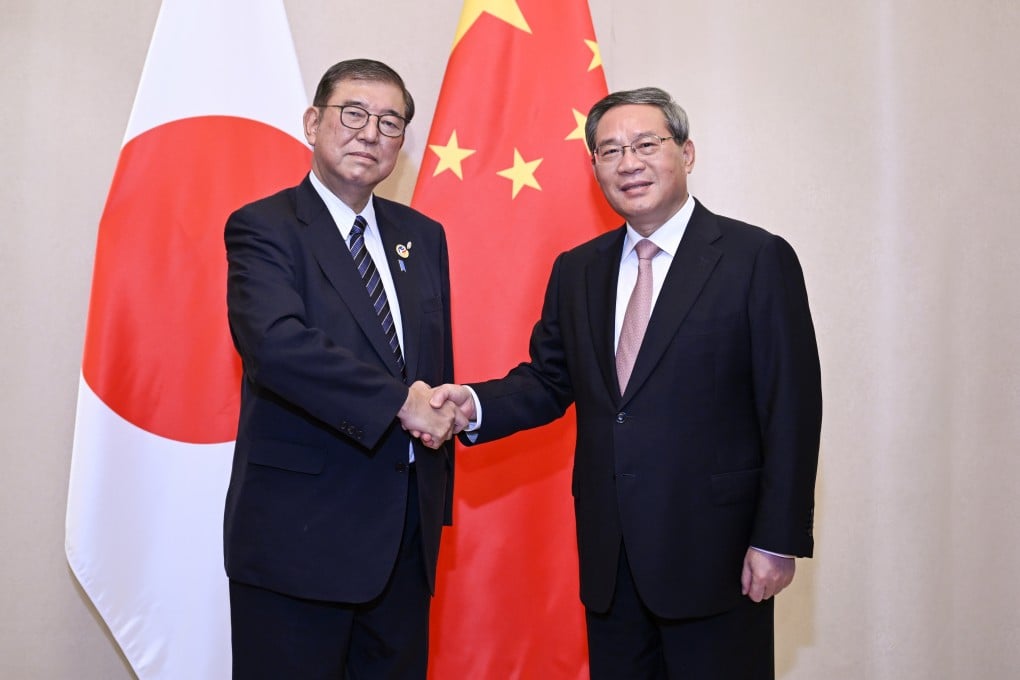 Japanese Prime Minister Shigeru Ishiba (left) and Chinese Premier Li Qiang on the sidelines of the Asean leaders’ meetings on East Asia cooperation in Vientiane on Thursday. Photo: Xinhua