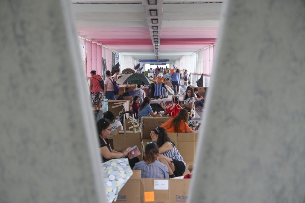 Foreign domestic workers are seen on a flyover in Admiralty, Hong Kong, on July 28. Photo: Jelly Tse