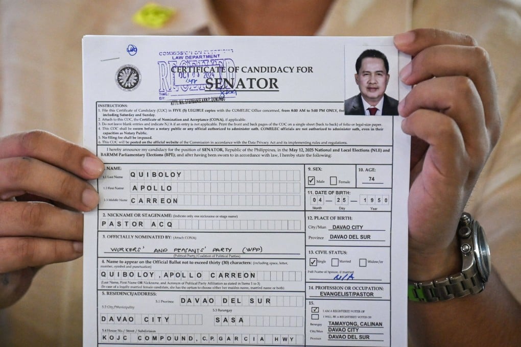 Apollo Quiboloy’s lawyer holds the Kingdom of Jesus Christ founder’s certificate of candidacy for the 2025 Senate elections on Tuesday. Photo: AFP