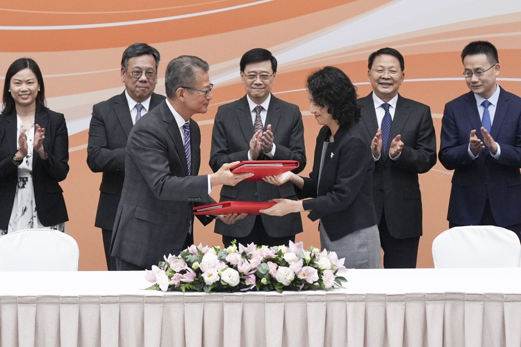 Hong Kong Financial Secretary Paul Chan Mo-po (front, left) and China’s Minister of Commerce, Li Yongjie (front, right), during the signing of an amendment to the Closer Economic Partnership Arrangement (CEPA). Photo: Eugene Lee